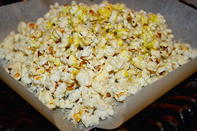 Popcorn with Grated Asiago, Cracked Black Pepper, and Wild Mushroom-Sage Olive Oil